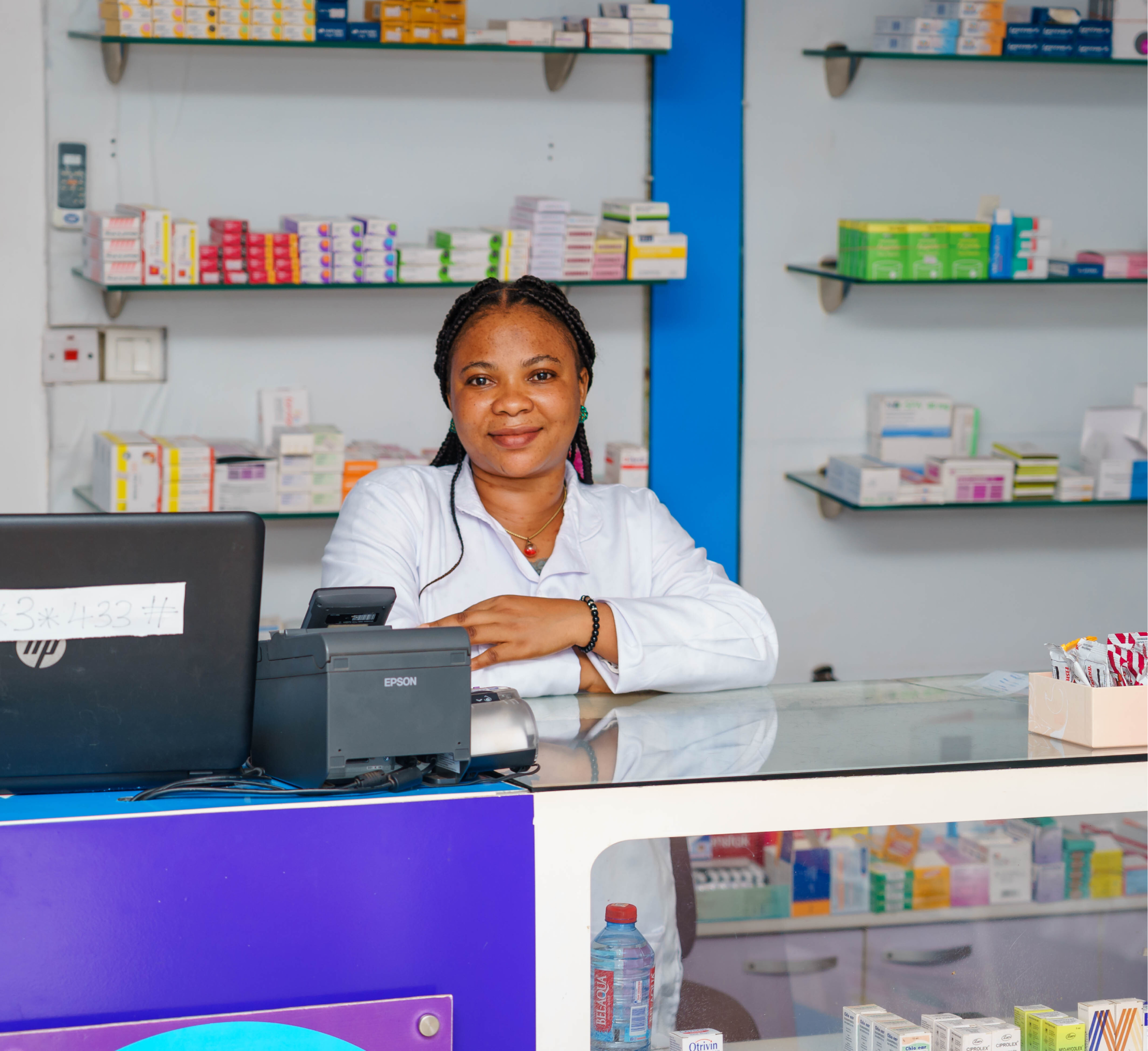 Pharmacist behind an Aide Chemists counter